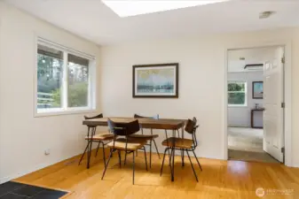 Dining with a view of the pretty front yard.