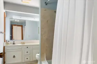 Shared bath w/large vanity and nice natural light.