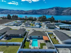 Aerial view showing the home's location just moments from Lake Chelan.