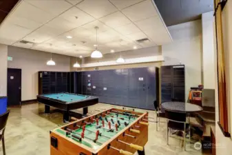 Foosball table, ping pong, pool table large tv, small kitchen & seating.