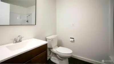 Main bathroom with tub and shower.