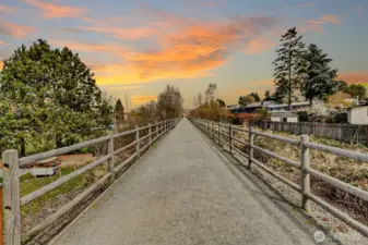 Enjoy walks or bike rides on Kirkland's most popular trail that just happens to be located a block from this home!