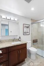 Updated Bathroom: Granite vanity, Toto toilet, large walk-in shower with tile surround,  hand-held shower, shampoo niche and flip-down shower seat, grab bar, heated floors, Delta quiet exhaust fan with humidity censor