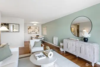 The living room opens seamlessly to the dining area off the kitchen with lots of light throughout.