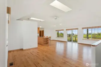 Main floor living space overlooking the front pasture, access to the back yard & deck!