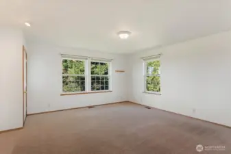 Primary bedroom suite with access to deck.