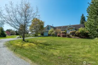 Front of home showcasing the mature landscaping & flower beds!