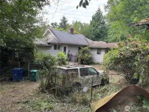 view of house from near the garage. Yes, the cars come with it