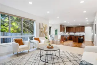 Seamless flow between living, dining, and kitchen spaces.
