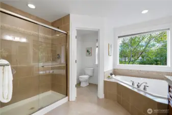 Spa-inspired ensuite with soaking tub and shower.