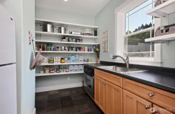 Second kitchen also with storage and utility room just behind on the left.