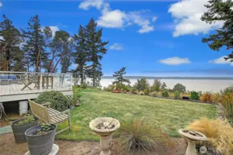 Big yard, situated on 65 feet of level, high-bluff waterfront…