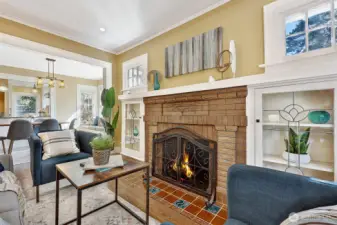 Gather around the beautiful period fireplace with custom glass-front display cabinets.