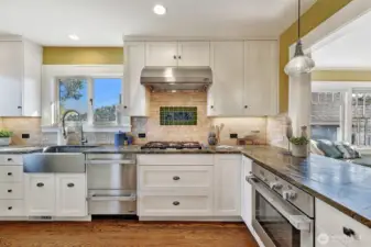 Chefs will love the stainless-steel appliances, stone countertops & designer tile backsplash.