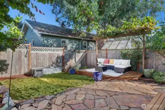 Step out to your own backyard oasis with a stone patio.