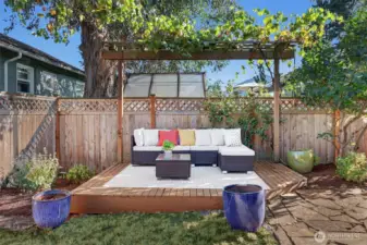 Recently re-stained deck with a gazebo makes for a lovely sitting area.