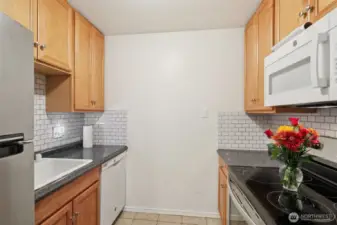 Kitchen with Stove, Microwave and Refrigerator
