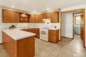 A functional design, offers useful work stations for multiple use of the kitchen...generous cabinetry!