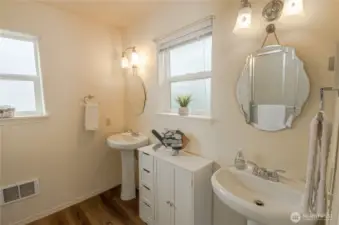 Primary bathroom with dual pedestal sinks
