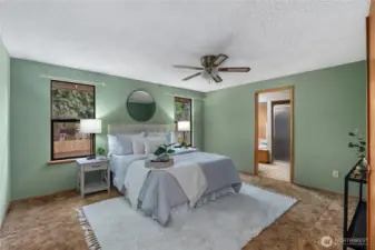 Large primary bedroom upstairs with view of backyard.   Three more bedrooms are located on the second level.