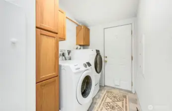 Laundry room to 2 car attached garage w/ workshop.