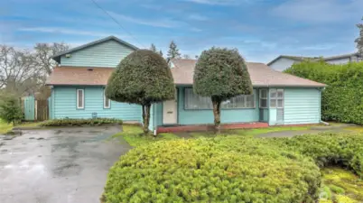 Extra wide lot and wrap around driveway