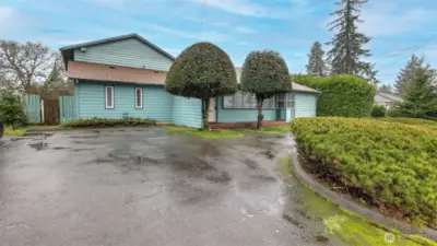 Extra wide lot and wrap around driveway