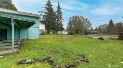 Large level backyard with alley access and pad near alley