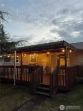 Back porch evening view with bistro lights. Photo credit: Erik Mullan