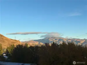 Burch Mountain views from open floor to ceiling windows.
