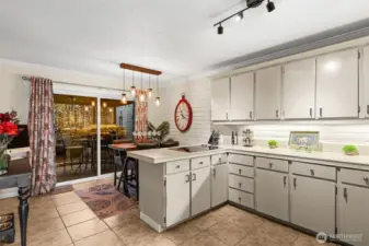 Floor to ceiling windows open onto sweet secret garden patio