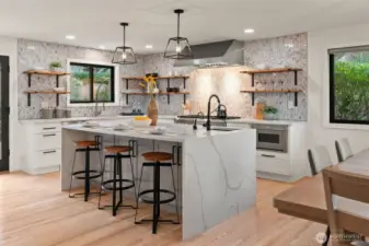 Updated kitchen with center island, quartz counters, tile backsplash, stainless appliances.