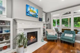Cozy sitting room off the kitchen with gas fireplace and beautiful Territorial views.