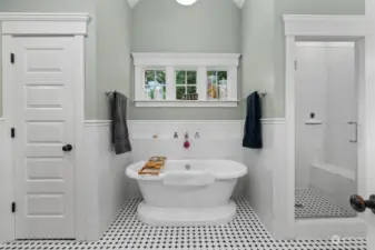 Primary luxury bathroom with classic details.