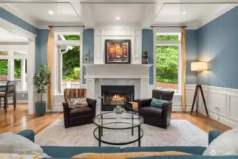 Spacious living room with classic style and woodturning fireplace.