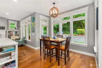 Kitchen nook with an abundance of windows, door to rear covered deck and lovely views.