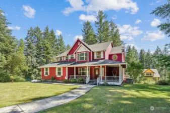 Welcome home! Walk up concrete path from cul de sac to your wraparound front porch!