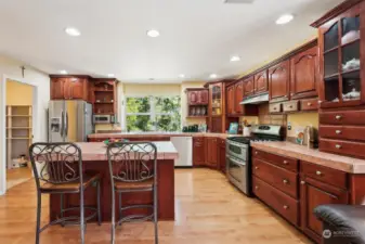 Gourmet custom kitchen with cherry wood cabinets.