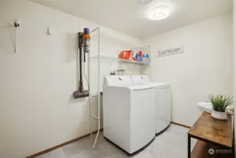 Main floor laundry room! New w/d that stay and new flooring. Adjacent to the garage so great mud room.