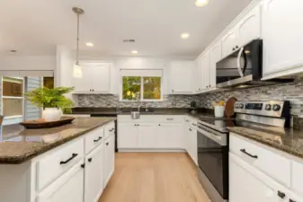 Granite counters and designer tile backsplash.