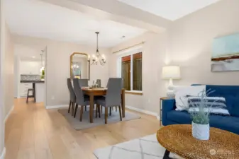 Formal dining room connects living room and kitchen.