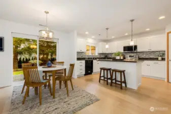 Wide plank engineered hardwood floors throughout the main level.