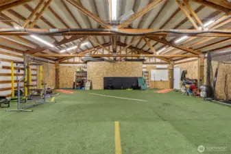 Loft area above shop is 36' x 40' and is currently used as an all season softball practice studio. Mini split by entrance door. Home office space? DADU possibly?