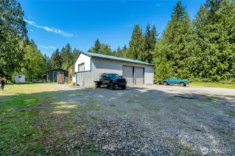 Shop, 20' x 20' green hay barn, 3 stall loafing shed behind hay barn.