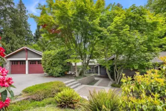 Welcome to this inviting home via a large, South-facing patio dappled with sunlight!