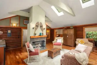 Open flowing sitting room with ample natural light.
