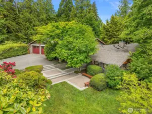 Spacious front yard, patios and stunning landscaping.