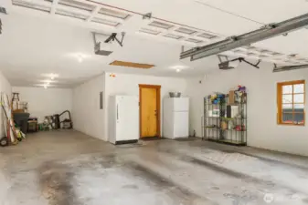 Spacious three car garage with option for boat parking & shop space.