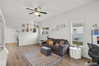 View from 2nd bedroom towards living area and kitchen
