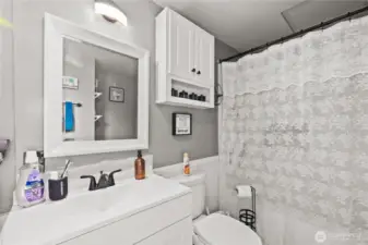 View from near laundry to bath and sink